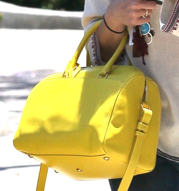 Selma Blair stylishly carries a Saint Laurent bag featuring top handles and a removable shoulder strap