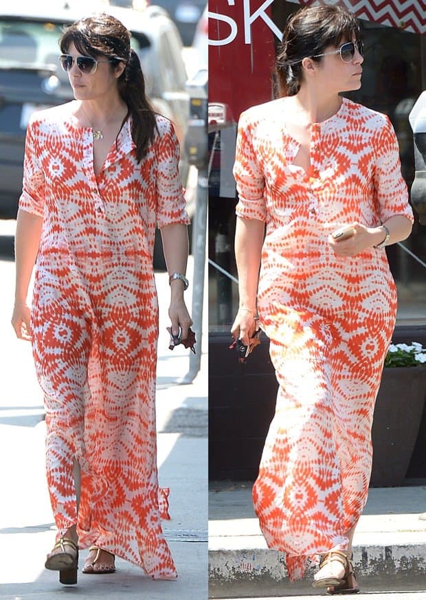 Selma Blair steps out in a bold tie-dye-inspired orange maxi shirtdress, pairing it with casual sandals for a relaxed shopping day in Los Angeles