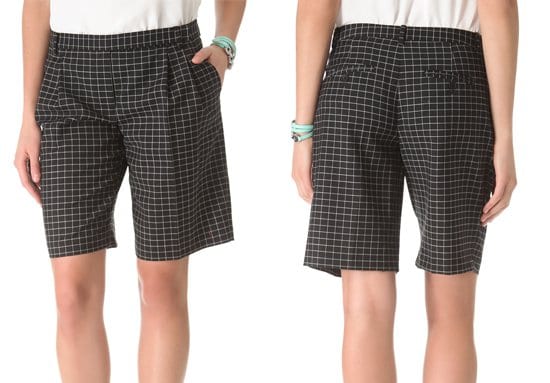 Deep pleats lend soft volume to a pair of crisp plaid shorts
