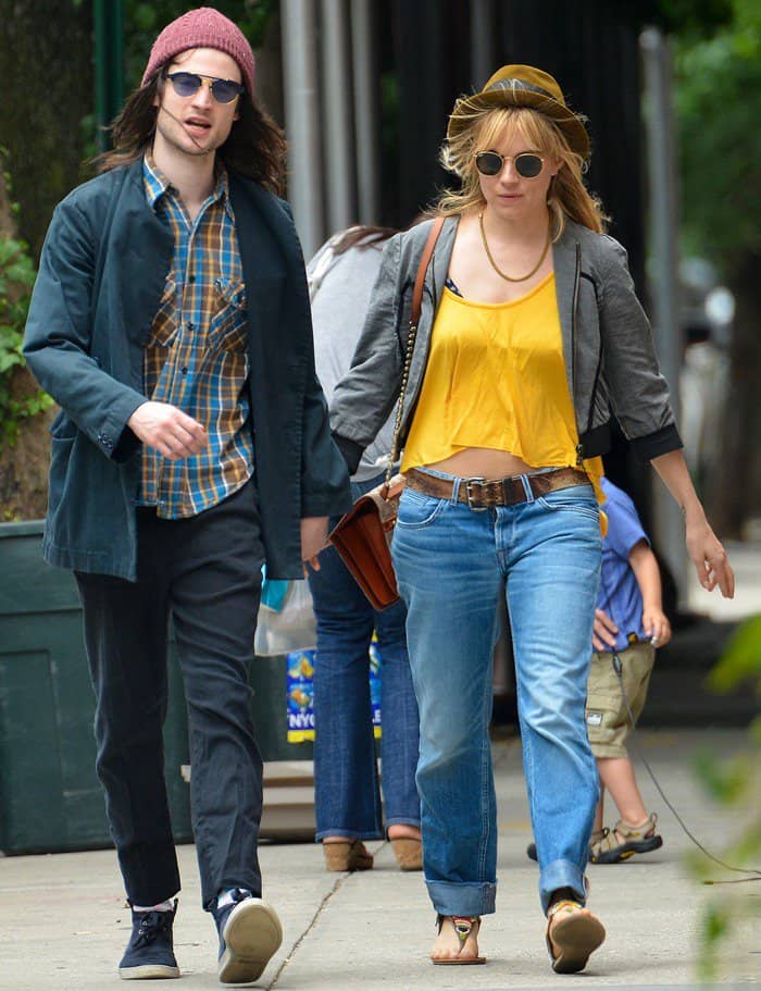 Sienna Miller rocked a pair of boyfriend jeans in faded denim when she went out for breakfast with her fiancé, Tom Sturridge