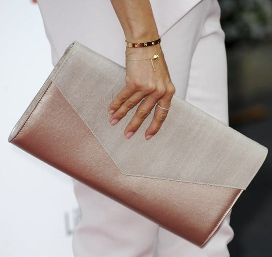 Eva Longoria confidently holds a tonal oversized envelope clutch at the Devious Maids premiere in Pacific Palisades