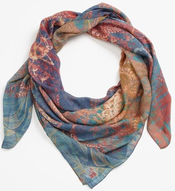 Rich swirls of vermilion and cerulean, indigo and gold crackle and flow across a sheer, sensational scarf designed by a Berlin-based artists' collective