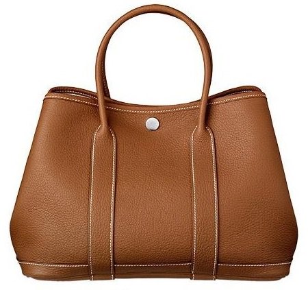The elegant Hermes 'Garden Party' Bag in Gold Negonda Leather, priced at $3,275, exemplifying luxury and understated style