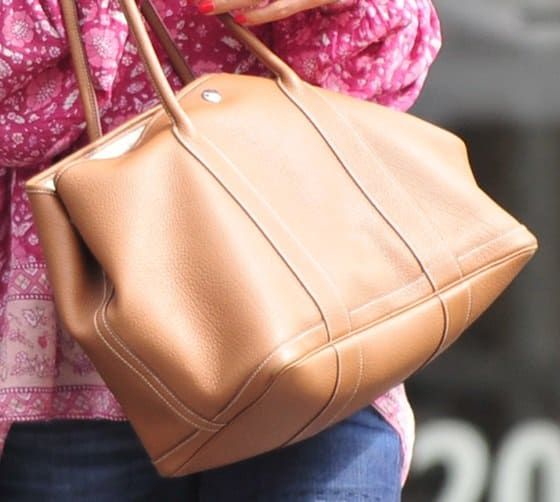 A detailed view of Jordana Brewster's versatile and stylish Hermes 'Garden Party' tan tote, a testament to her sophisticated and timeless fashion sense