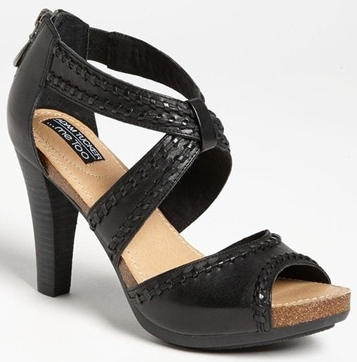 Whipstitched trim embellishes a memory foam-cushioned sandal set on a stacked heel and covered platform.