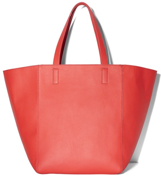 Close-up of the Vince Camuto 'Coco' Tote showcasing its spacious design in fiery coral