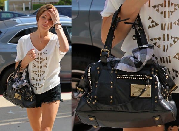 The Louis Vuitton 'Rivets' handbag serving as a great match for Ashley Greene's edgy day look