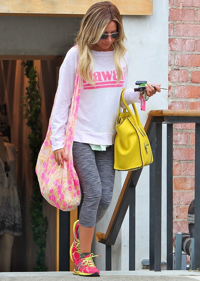 Ashley Tisdale sporting a “Hawaii” shirt as she heads back to her car after doing some retail therapy at a local store in Studio City, California, on July 11, 2013
