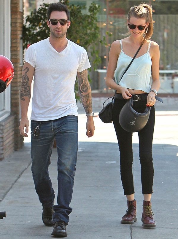 Adam Levine and Behati Prinsloo return to their parked motorcycle after having lunch at Mustard Seed Cafe in Los Feliz on August 7, 2012