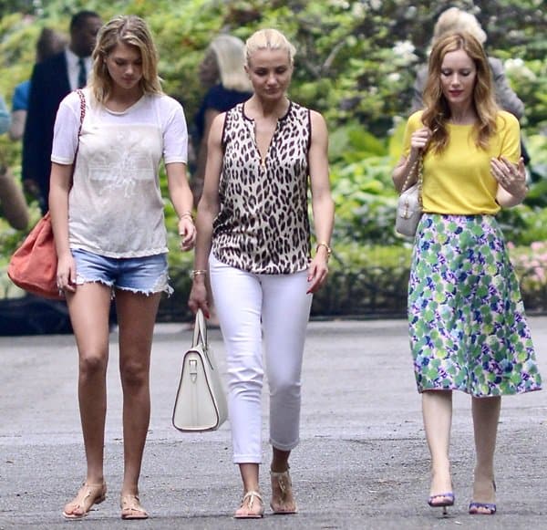Kate Upton on the left is casual in a white tee and denim shorts, Cameron Diaz in the middle opts for chic with a leopard print top and white pants, and Leslie Mann on the right pairs a sunny yellow tee with a floral knee-length skirt