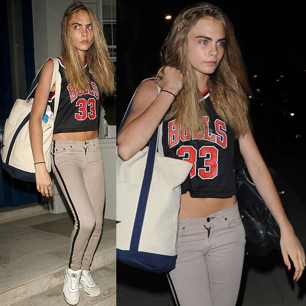 Cara Delevingne arriving in striped khaki jeans at a dance studio