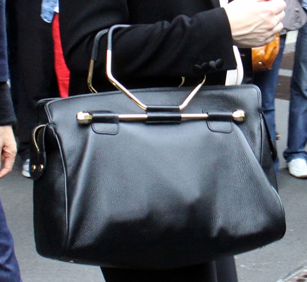 Cate Blanchett carries a black Viktor & Rolf Bombette bag in Milan