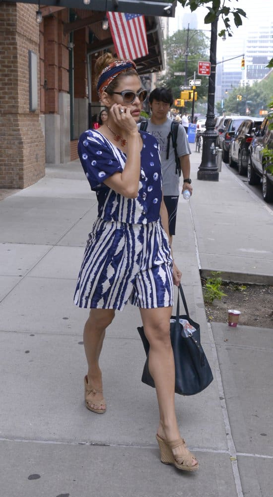 Eva Mendes wears a red-and-blue headscarf while leaving her hotel in Manhattan