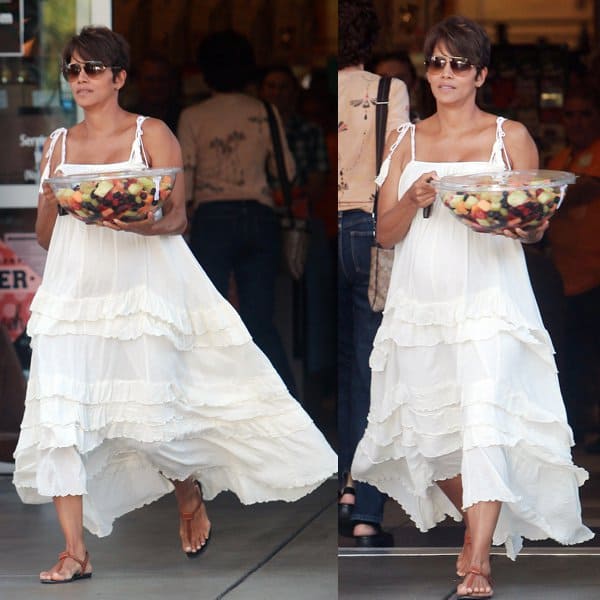 Radiant Halle Berry, newly married, exits a Los Angeles supermarket carrying a large bowl of fruits on July 27, 2013