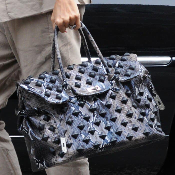 Heidi Klum toting a studded snakeskin Birkin as she arrived at her hotel in Manhattan, New York City, on July 11, 2013