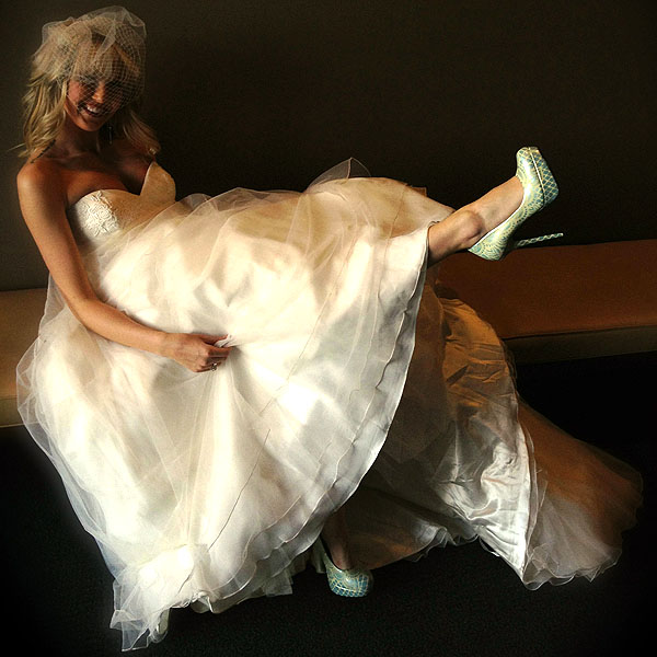 A bride in her Hourglass Footwear "Something Borrowed" Pumps