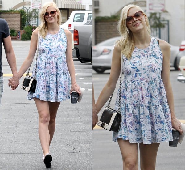 Jaime King radiates in a lavender and blue printed skater dress by Lovers + Friends, accessorized with a Chanel shoulder bag during a day out