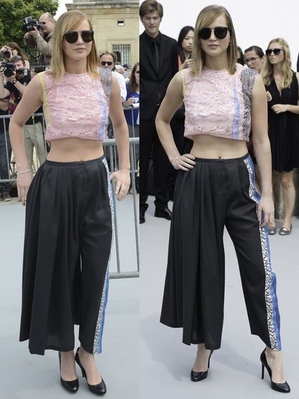 In a suave display of fashion, Jennifer Lawrence sports charcoal wool pants from Christian Dior's Resort 2014 collection at the Paris Men's Fashion Week