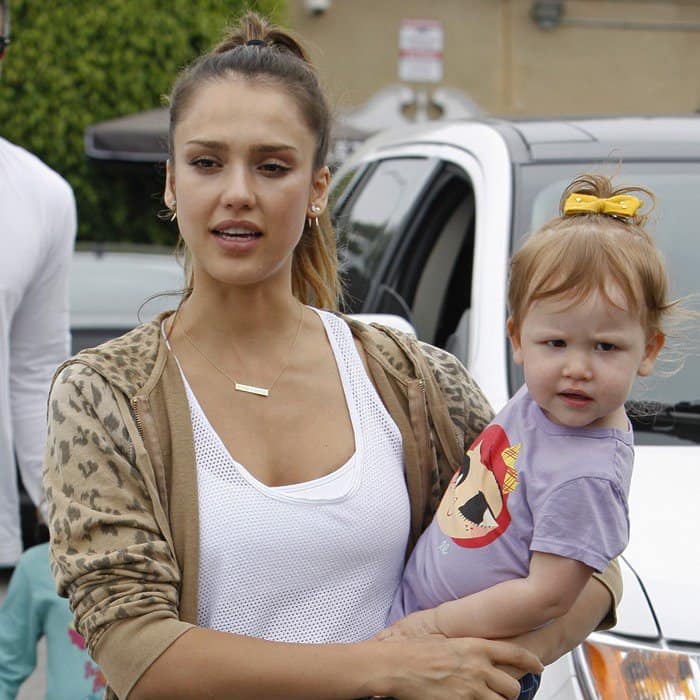 Jessica Alba rocking a camel leopard hoodie sweatshirt and a personalized nameplate necklace with style