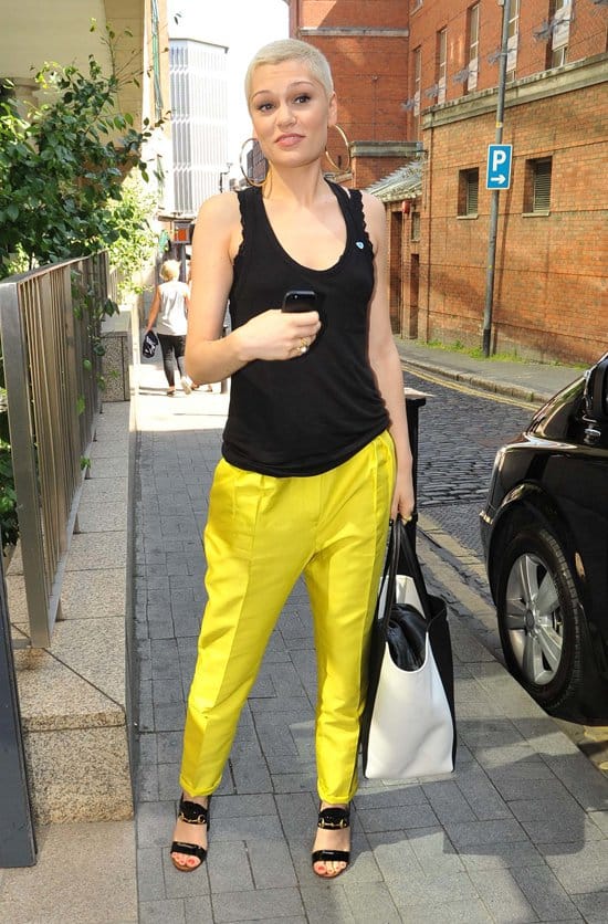 Jessie J greets fans with a smile outside the Today FM studios in Dublin, clad in striking yellow trousers, despite recent throat issues