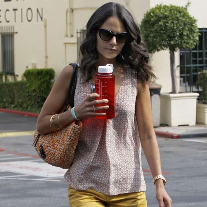 Jordana Brewster casually dressed in yellow shorts and sunglasses while running errands in Los Angeles