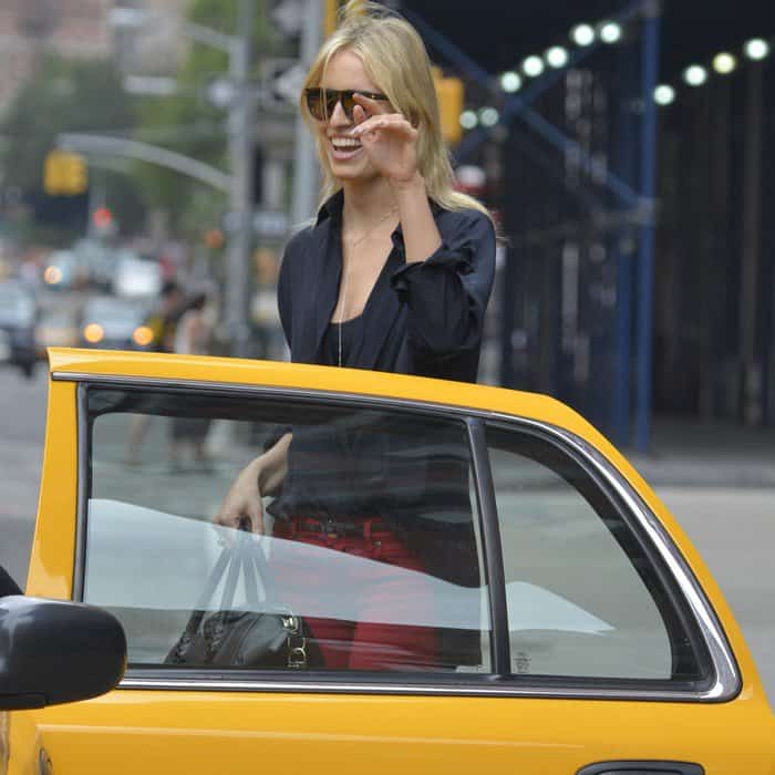 Karolina Kurkova flashes a bright smile as she steps into a New York City cab