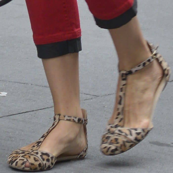 Karolina Kurkova adds a bold finishing touch to her relaxed look with a pair of chic leopard-printed ankle-strap flats