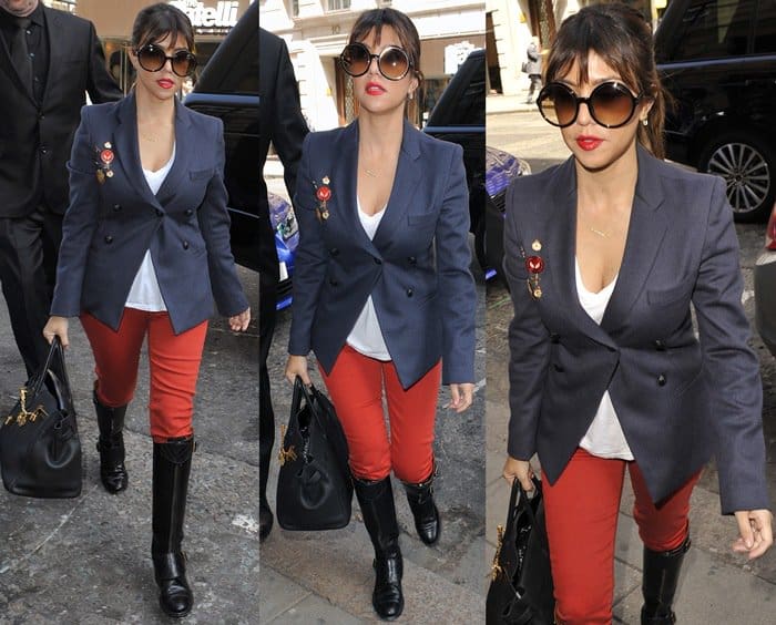 Kourtney Kardashian wearing red pants with knee-high boots
