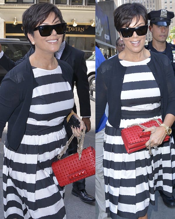 Kris Jenner dazzles in a striped monochrome Dolce & Gabbana dress, complemented by a vibrant red Valentino purse, outside The Today Show