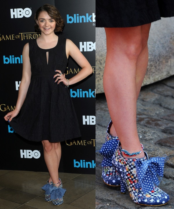 Maisie Williams matching her sexy black dress with a pair of blue polka-dot bow shoes