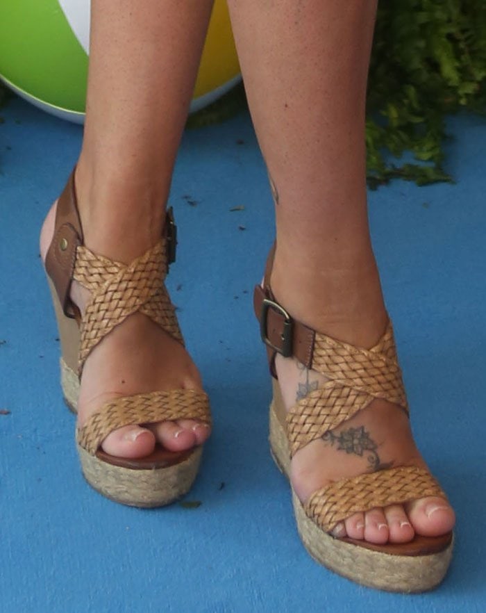 Michelle Heaton's feet and foot tattoos in brown woven wedge heels