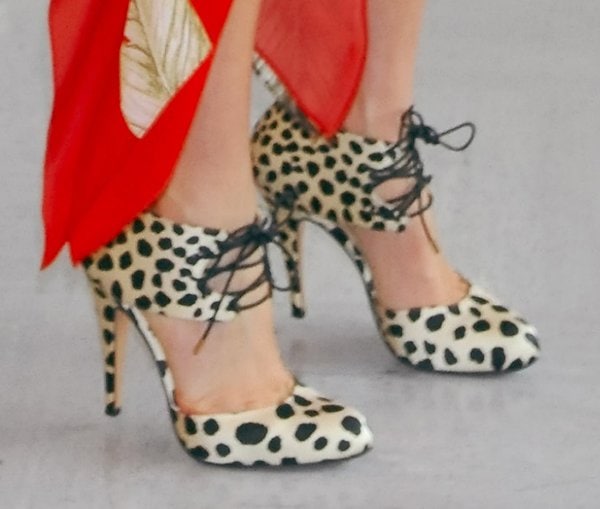 Miranda Kerr wearing leopard-printed crepe satin pumps