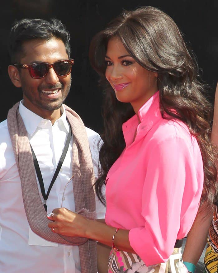 Nicole Scherzinger shines in a hot-pink shirt and a graphic skirt, looking radiant at the X Factor UK event
