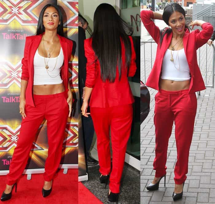 Nicole Scherzinger stuns in a vibrant red blazer and matching trousers, paired effortlessly with a white crop top and sleek black pumps, creating a chic and confident look