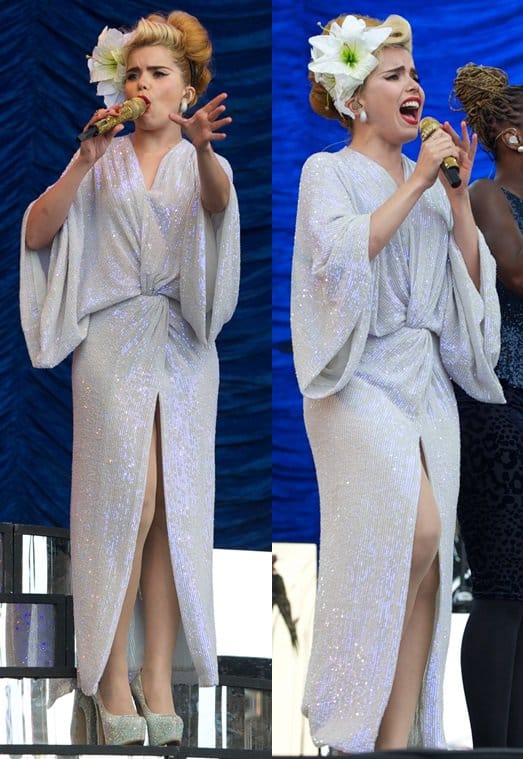 Paloma Faith channels Greek elegance in a Diane von Furstenberg sequined dress at T in the Park, featuring a daring v-neck and high front slit, complemented by floral hair accessories and silver platforms
