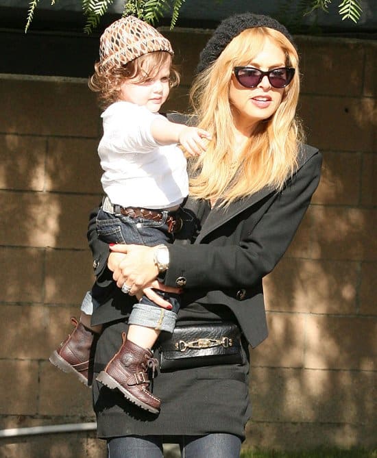 Rachel Zoe rocks a belt bag while carrying her son Skyler outside Hugo's Restaurant