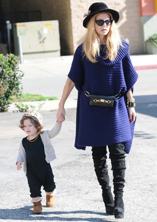 Rachel Zoe showcases her signature belt bag while on a casual outing with her son Skyler in Los Angeles, November 19, 2012
