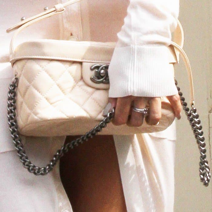 Detailed view of Rihanna's Chanel quilted handbag showcased at Paris Fashion Week 2013