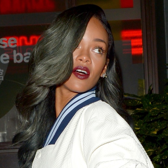 Rihanna radiates in red lipstick during a lively night out with friends at Cirque le Soir in London, July 2013