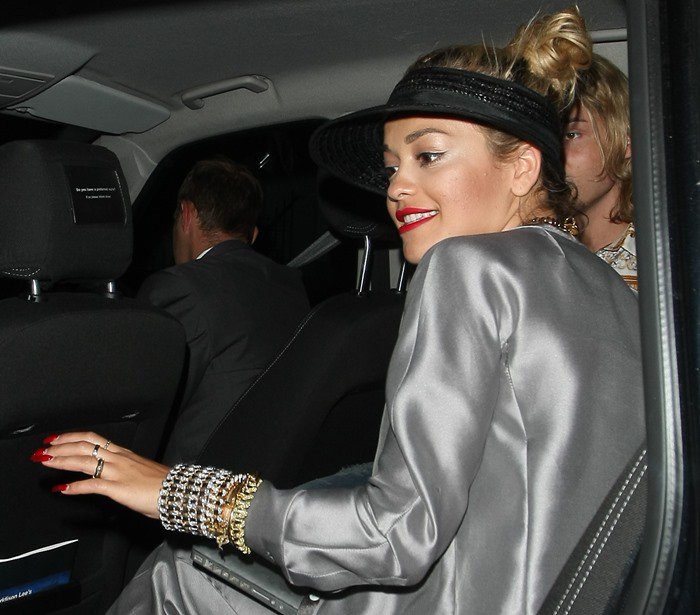 Rita Ora leaving a recording studio in a silver Armani suit in London on July 12, 2013