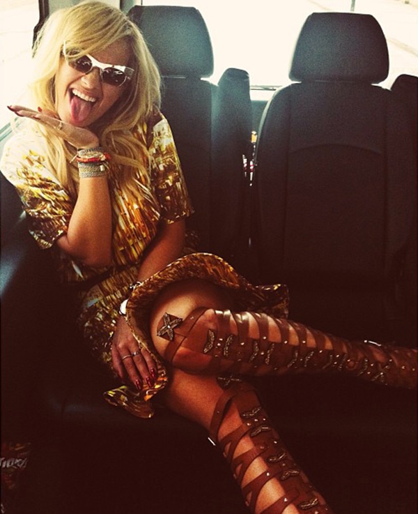 Rita Ora radiates bold summer vibes in Altuzarra gladiator sandals and a gold-patterned dress en route to the Yahoo Wireless Festival in London on July 13, 2013