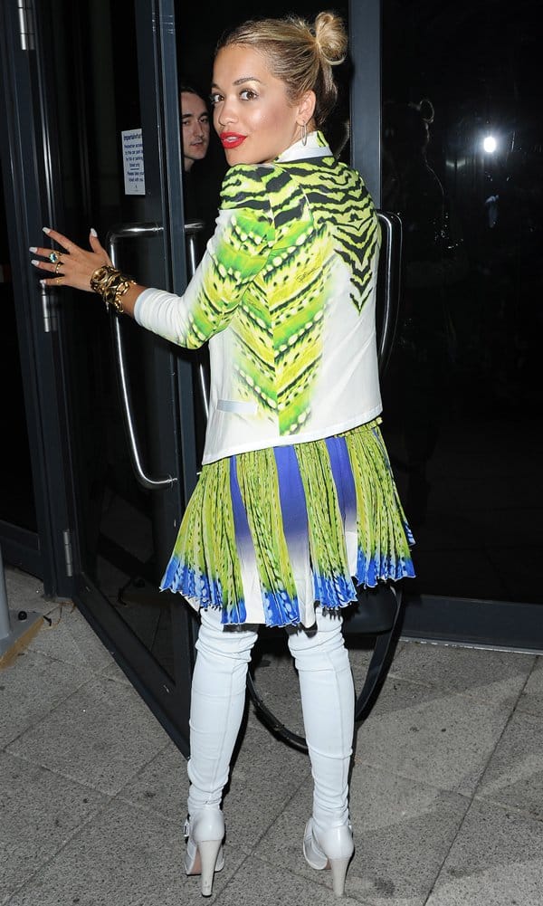 Rita Ora styled an edgy and vibrant ensemble featuring Altuzarra thigh-high boots, a Just Cavalli Spring 2013 jacket, and a fluorescent print plissé dress from Just Cavalli at the Scotch Club on July 26, 2013