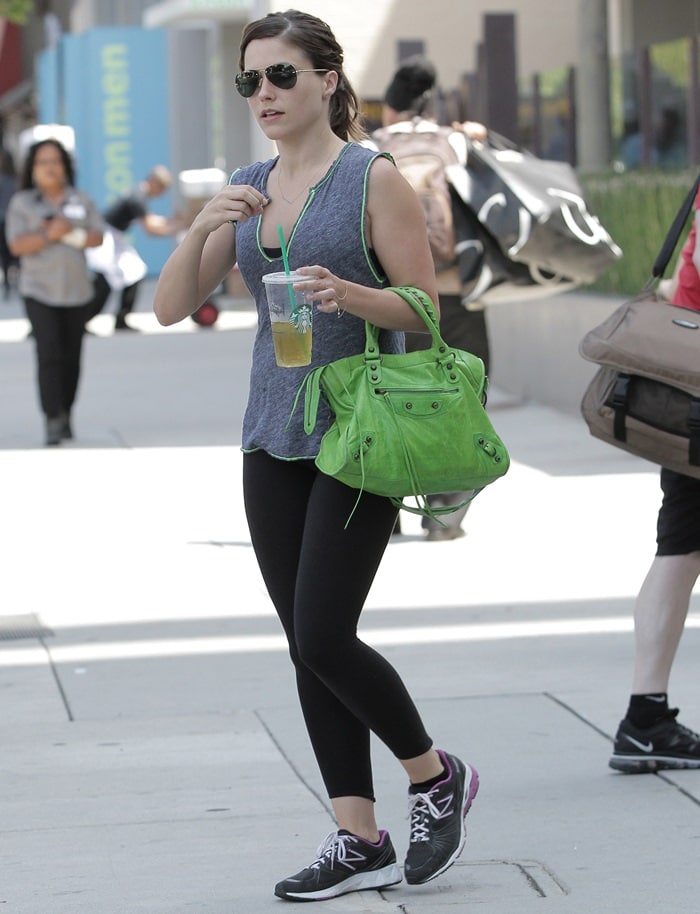 Sophia Bush toting a lime green Balenciaga bag while leaving the gym in West Hollywood, California, on July 25, 2013