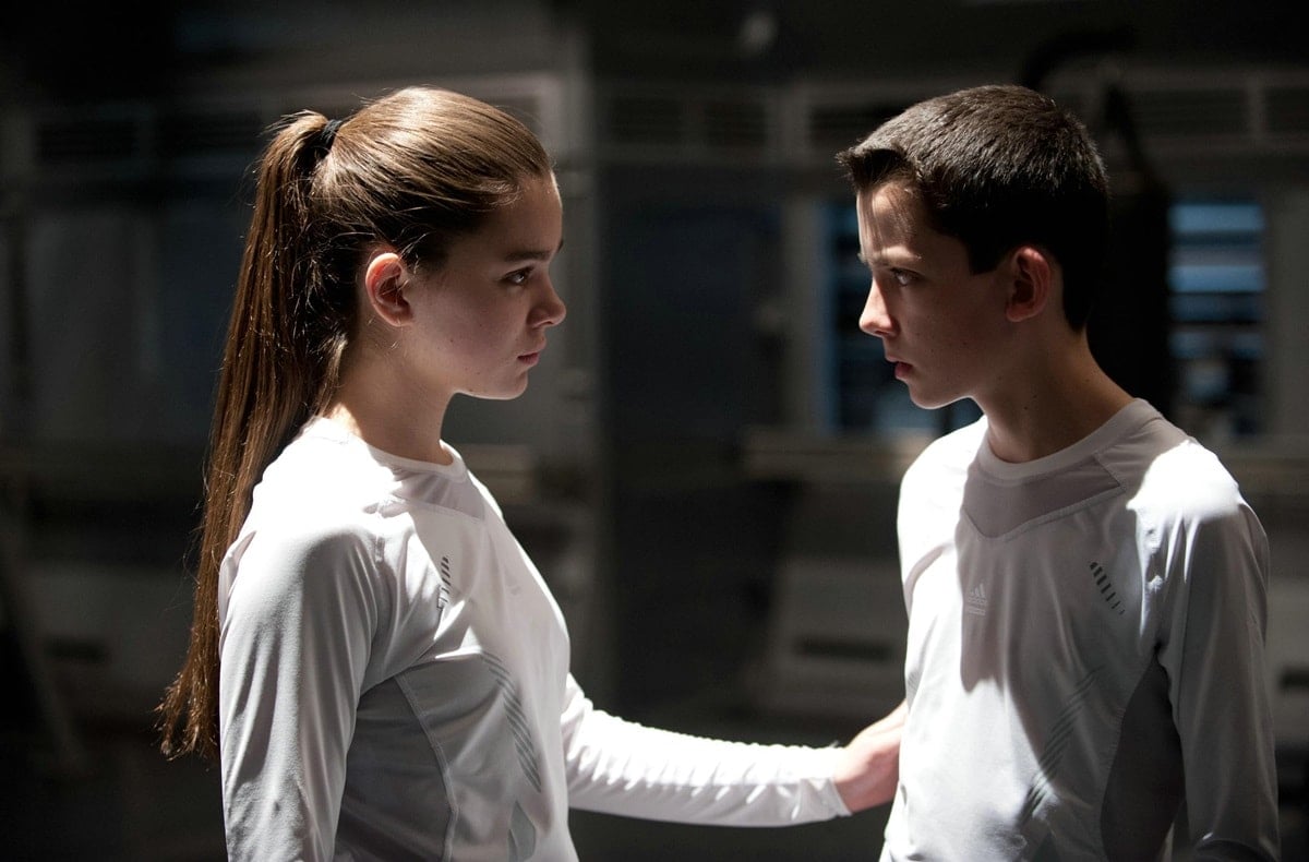 Hailee Steinfeld stars in Ender's Game alongside Asa Butterfield, who plays Ender Wiggin, a brilliant youngster sent to a military academy in space to prepare for an alien invasion