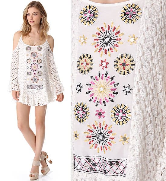 Model showcases a white crochet mini Tbags dress with colorful embroidered details and shoulder cutouts, perfect for summer chic styling