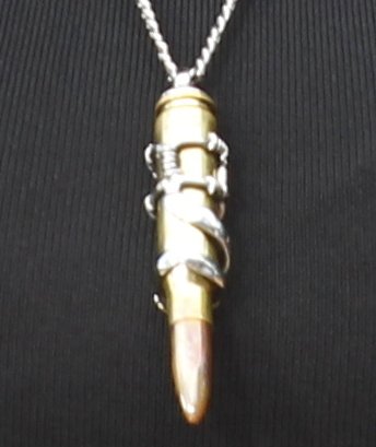A closer look at Tyra's bullet pendant necklace