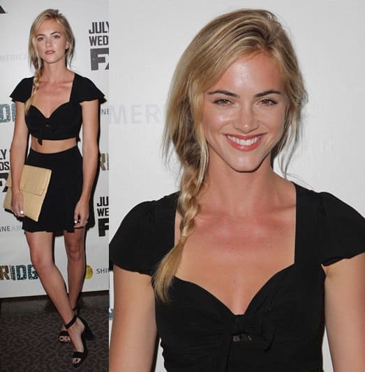 Emily Wickersham turned heads in a flirty black two-piece set, pairing it with ankle-strap heels, a woven envelope clutch, and crisp white nail polish for a modern finish