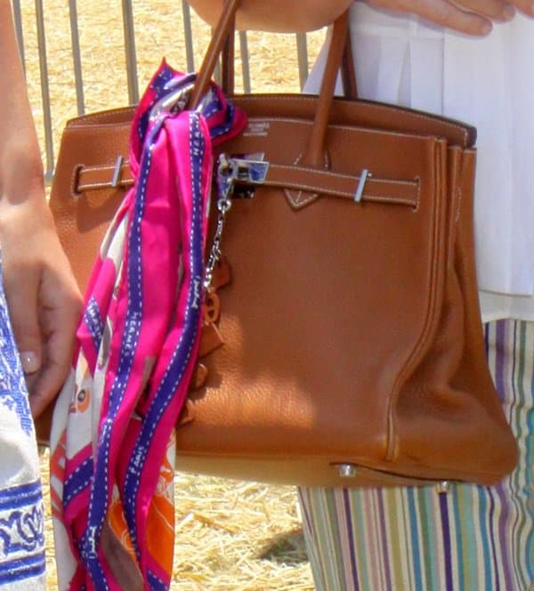 Kathy Hilton stylishly decorated her Hermes bag with a bright and colorful scarf