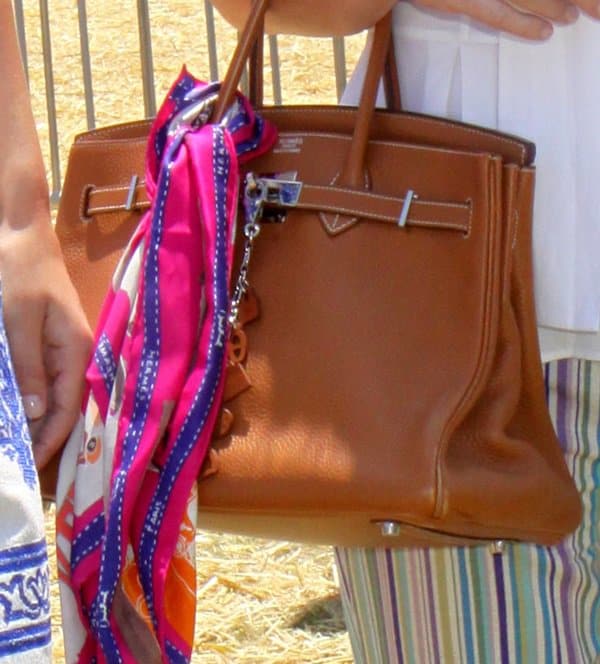 Style Highlight: Kathy Hilton enhances her look with a colorful Hermes scarf on her iconic bag
