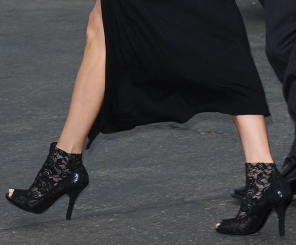 A close-up of Maggie Q's black lace peep-toe booties, which perfectly complement her bold Comic-Con 2013 look